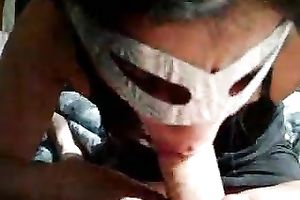 Masked cock sucker attacks my knob with her throat