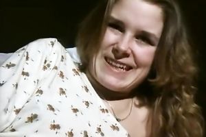 Naughty white curvy golden-haired lady flashes her cunt on the sofa