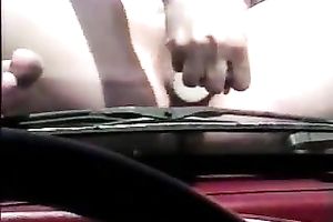Curvy girl takes a sunbath and bonks herself with sex toy on my car