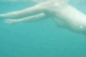 My charming slutwife swims underwater and her arse muscles work