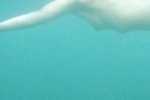 My charming slutwife swims underwater and her arse muscles work