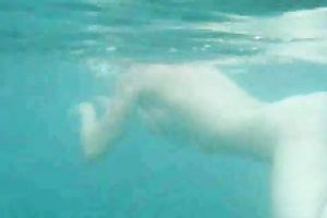 My charming slutwife swims underwater and her arse muscles work