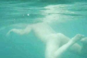 My charming slutwife swims underwater and her arse muscles work