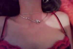 Busty dark brown in straps and nylons is posing for a webcam