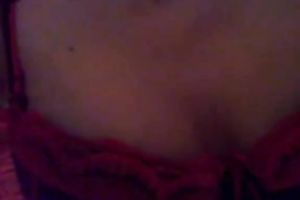 Busty dark brown in straps and nylons is posing for a webcam