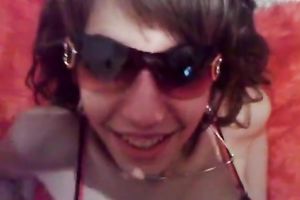 Busty dark brown in straps and nylons is posing for a webcam