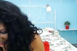 Busty dark brown mature model still looks seductive on web camera