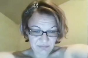 Aged slutty wife in glasses pleases herself with fingers and a sex tool