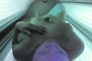 Bosomy playgirl caught fingering her snatch in a solarium