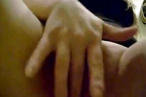 Horny and perverted slut with black hair fingering her love button