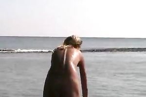 My charming European golden-haired GF on the beach all in nature's garb