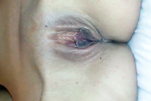 My charming gf lies in couch and I play with her bald pink pussy
