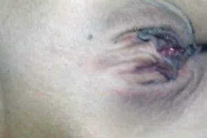 My charming gf lies in couch and I play with her bald pink pussy