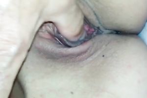 My charming gf lies in couch and I play with her bald pink pussy