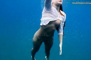 Slender and juvenile redhead harlot in the unfathomable blue sea