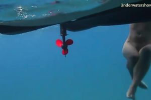 Slender and juvenile redhead harlot in the unfathomable blue sea