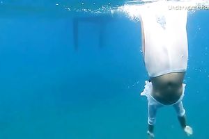 Slender and juvenile redhead harlot in the unfathomable blue sea