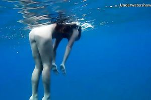 Slender and juvenile redhead harlot in the unfathomable blue sea
