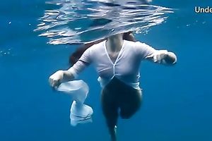 Slender and juvenile redhead harlot in the unfathomable blue sea