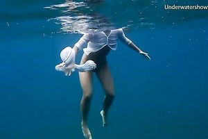 Slender and juvenile redhead harlot in the unfathomable blue sea