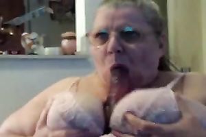 Horny and excited older fattie engulfing a fake penis on web camera