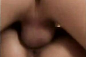 Busty girlfriend rides her fellow on the dining table in the kitchen