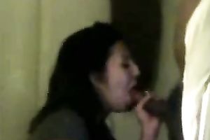 Lusty Indian black cock sluts with pretty face is engulfing my dick while watching porn movie scene