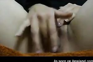 That wench with hairless large slit masturbated on the web camera