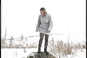 Cute youthful white honey pissing outside in a snowy day