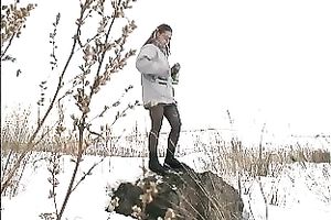 Cute youthful white honey pissing outside in a snowy day