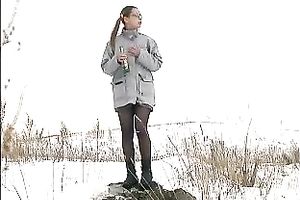 Cute youthful white honey pissing outside in a snowy day