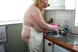 My kewl aged Russian amateur wife does kitchen work exposing her giant boobs