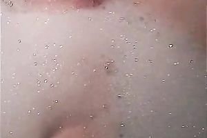 Brunette bitch in the bathtub filled up with aromatic lather