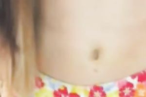 Adorable legal age teenager showing her stomach button and curly pussy