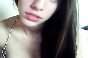 Charming dark brown chick with charming lips positions on cam