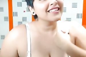 Short-haired web camera beauty is damn proud of her large boobies