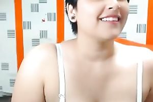 Short-haired web camera beauty is damn proud of her large boobies