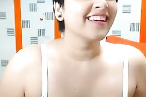 Short-haired web camera beauty is damn proud of her large boobies