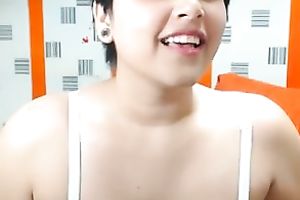 Short-haired web camera beauty is damn proud of her large boobies