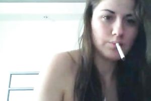 Sultry black haired web camera sexpot smokes in advance of masturbating