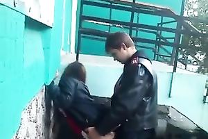 My buddy copulates a whore's twat from behind in the street