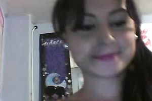 Hot brunette hair is in a playful moodto flash her scoops