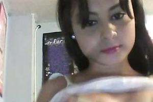 Hot brunette hair is in a playful moodto flash her scoops