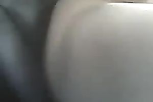 Nasty brunette hair floozy is shoving her muff with a bottle masturbating in my car