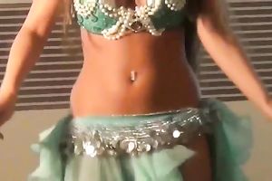 Well shaped girlie dancing seductively in eastern costume