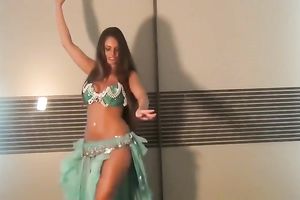 Well shaped girlie dancing seductively in eastern costume