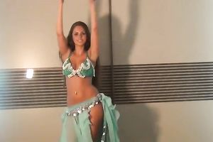 Well shaped girlie dancing seductively in eastern costume