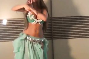 Well shaped girlie dancing seductively in eastern costume