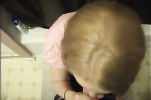 Cute colleague in her office suit sucks and swallows