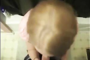 Cute colleague in her office suit sucks and swallows